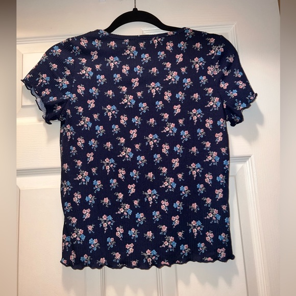 Navy blue tee with pink and blue flowers. - Picture 2 of 3
